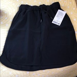 Lululemon “on the fly” black skirt.